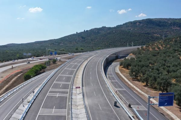 Explore a pristine highway surrounded by lush hills in Küçükkuyu, Turkey.